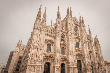 Fototapeta premium Milan, Italy, April 2020, Front of the Duomo (Milan Cathedral), in downtown of the city closed , empty of people during covid19 Coronavirus epidemic