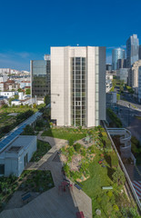 Courbevoie, France - 04 16 2020: View of the Defense towers district and gardens at sunset