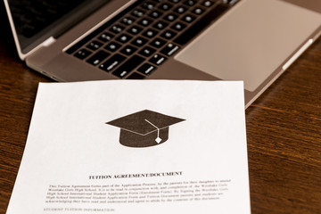 college or university application or document from school. College acceptance letter or student loan paper. Applicant filling form or planning studies.