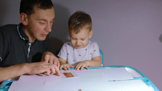 father deals with the child, child education, lessons with a child, home study