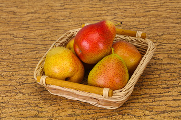 Pear heap in the wooden basket