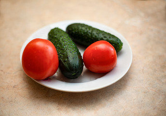 tomatoes and cucumbers on the table