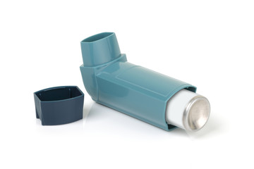 Asthma inhaler on a white background with light reflection