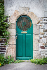 Old wood door green closed with beautiful design