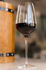Special wine pours from wooden barrel. Red France wine into a wine glass