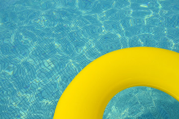 Colorful inflatable tube floating in swimming pool