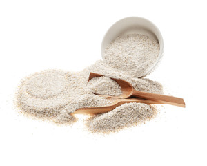 whole barley flour with wooden spoon and porcelain bowl isolated on white background