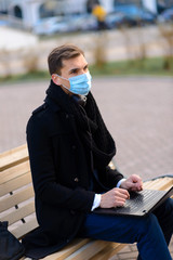 Fototapeta premium People with face mask. Concept with copy space. Portrait of adult man in quarantine of flu. Photo on the street in the city