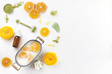 self-care kit for body and face. soap nuts, coconut oil, spirulina powder, jade roller for massage guasha, towel. DIY eco cosmetics. concept zero waste, no plastic, sustainable. copy space. flat lay