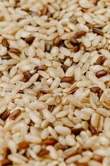 A mixture of brown and red rice. Rice cereal texture. Background and texture. Healthy Food, Asian
