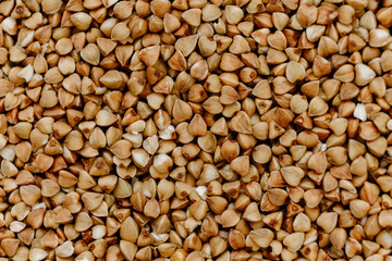 Raw uncooked buckwheat grains texture, background