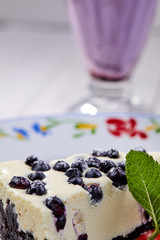 cheesecake with fresh blueberries and mint