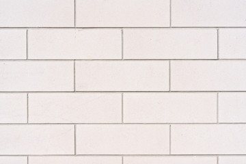 Image of a White Brick Wall Pattern with repeating brick pattern and symmetry