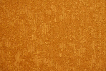 Texture of a golden fabric wallpaper.