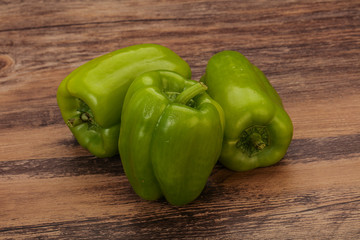 Three green bell juicy peppers