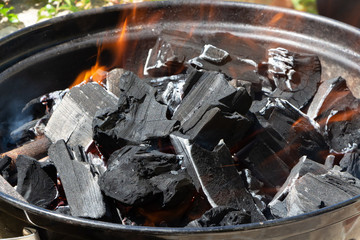 Barbecue lit in a garden for grilling meat