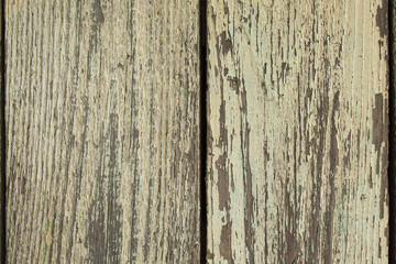 Naklejka premium The texture of vintage wooden boards, grunge. Background of vertical planks, closeup.