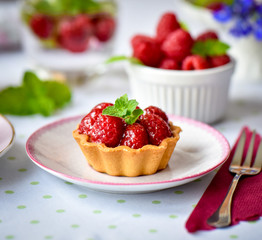 Mini tart with raspberries fruits on the table
