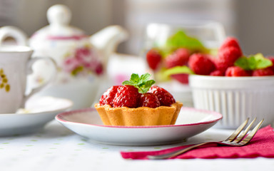 Mini tart with raspberries fruits on the table
