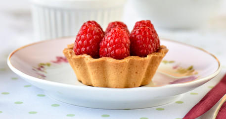 Mini tart with raspberries fruits on the table
