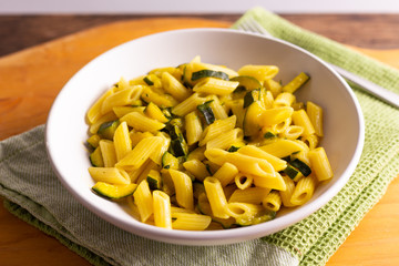 Penne pasta with zucchini and saffron.