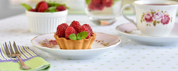 Mini tart with raspberries fruits on the table

