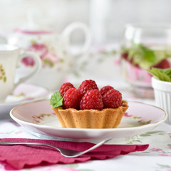 Mini tart with raspberries fruits on the table
