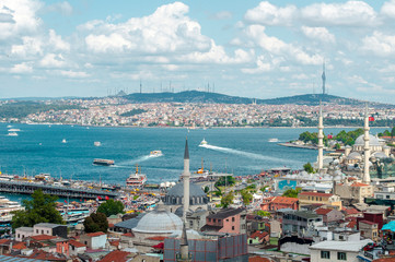 Naklejka na ściany i meble Top view. Golden Horn, Bosphorus in background. White pleasure ships. Seagulls flying over water. popular tourist destination. Red tiled roofs. Turkey, Istanbul