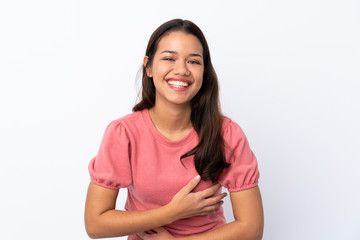 Young Colombian girl over isolated white background smiling a lot