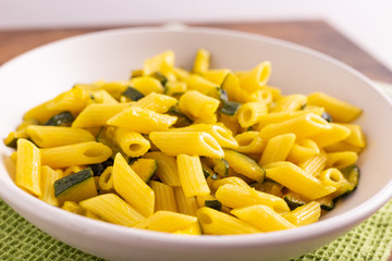 Penne pasta with zucchini and saffron.