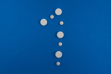 Sign number one Made From Capsules Over Blue Background