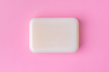 Soap bar isolated on pink background.