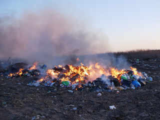 burning garbage dump. burning garbage. concern for the environment. environmental pollution.