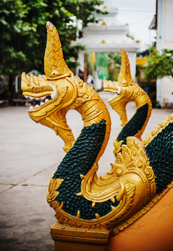 Golden dragon statue in Vientiane, Laos, Southeast Asia
