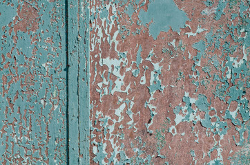 Old iron fence. Old cracked paint. Vintage fence. Rusty metal. Rust structure. Old vintage door handle. Padlock. Iron gate.