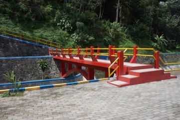 Fototapeta na wymiar the colorful bridge in the Progo dam area in Badran village, Temanggung district, central java at noon