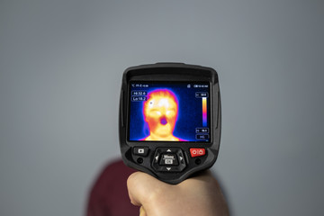 Thermal camera vision of woman, Coronavirus high fever control, Covid-19 protection concept