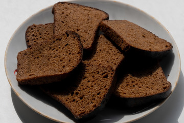 brown bread lies on a plate in the kitchen