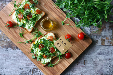 Selective focus. cbd oil note. Toasts with microgreens and cannabis oil. cbd food concept.