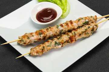 Minced pork skewer kebab with sauce