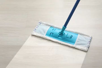 Fotobehang Cleaning of floor with mop © Pixel-Shot