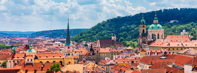 Naklejka na ściany i meble Top view to red roofs skyline of Prague city, Czech Republic. Aerial view of Prague city with terracotta roof tiles, Prague, Czechia. Old Town architecture with terracotta roofs in Prague.