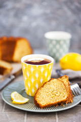 Lemon cake slices and cup of hot black tea