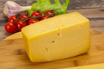 Hard yellow tasty cheese brick