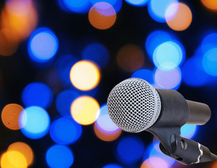 Microphone on abstract blurred of speech in seminar room or speaking conference hall light, Bogeh Background
