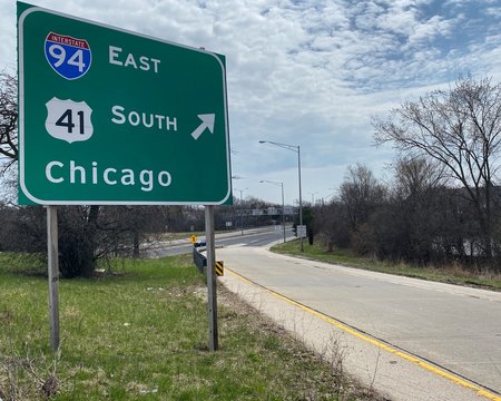 Entrance ramp onto a near-empty Interstate 94 outside of Chicago during the Coronavirus pandemic. The highway would usually be full of cars on a holiday weekend.