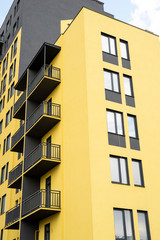 black and yellow high-rise building, element of a multi-colored residential building