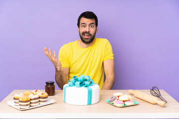 Man in a table with a big cake making doubts gesture