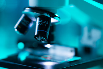 Fototapeta na wymiar Close-up of scientific microscope. Laboratory in hospital. Epidemic disease, healthcare, vaccine research and coronavirus covid-19 test.
