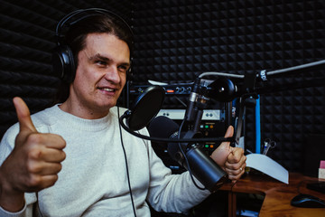 Talking male radio presenter in radio station